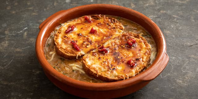 French onion soup with miso, Gruyère and hot honey